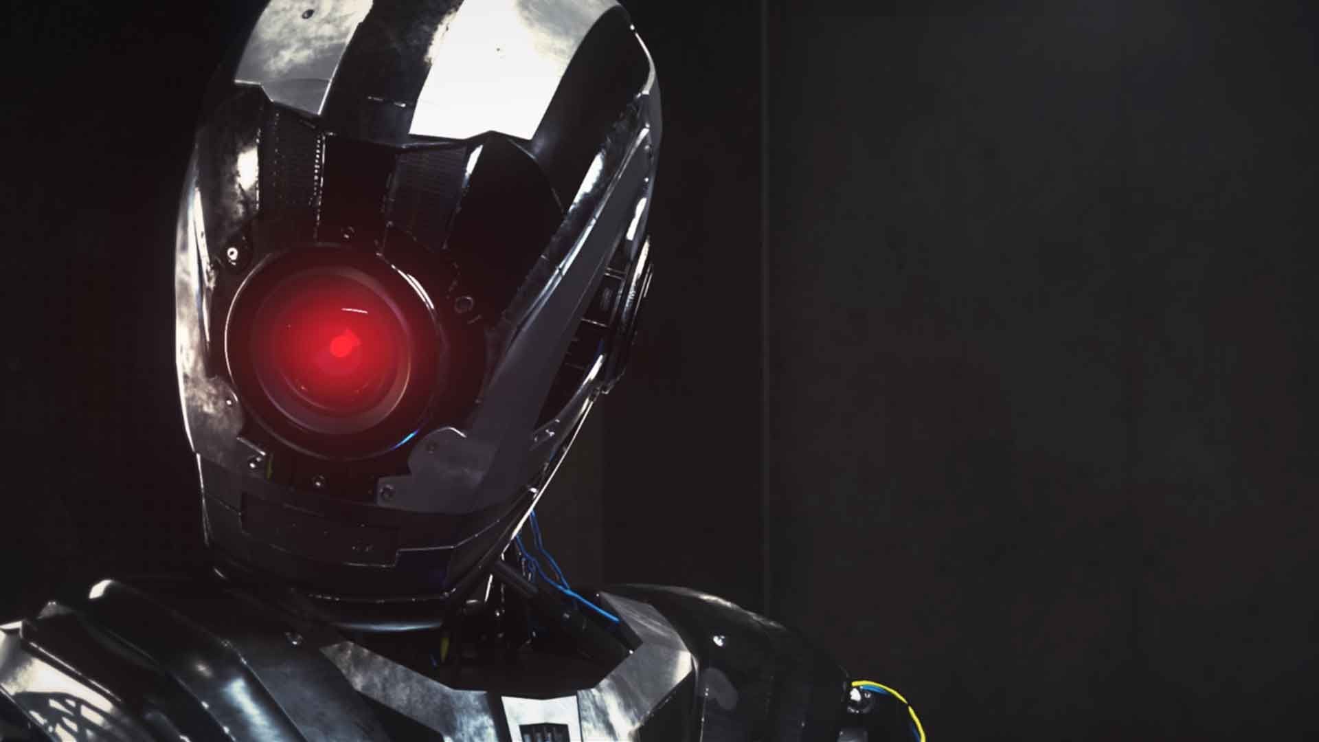 Animated robot like character against a dark background